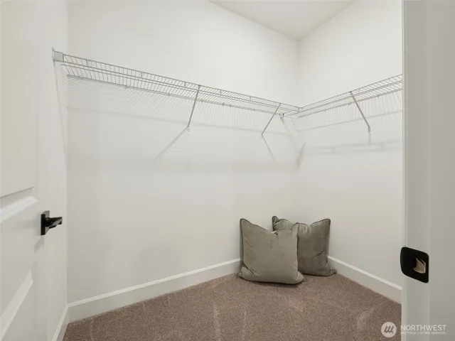 a view of a swimming pool with a table and chairs