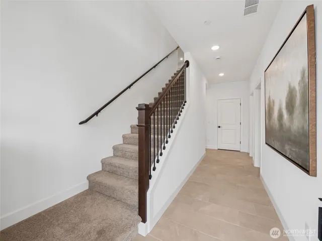 a bathroom with a double vanity sink mirror and toilet