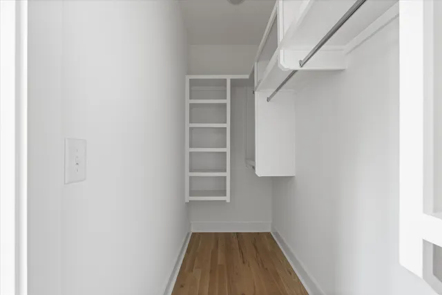 a view of wooden floor in an empty room