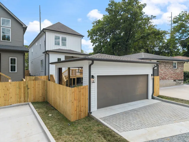 a front view of a house with a garage