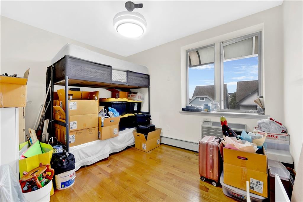 1270 Bay Ridge Parkway, Unit 6 Brooklyn, NY 11228 - Photo 19 of 24 a bed room with a bed and a window
