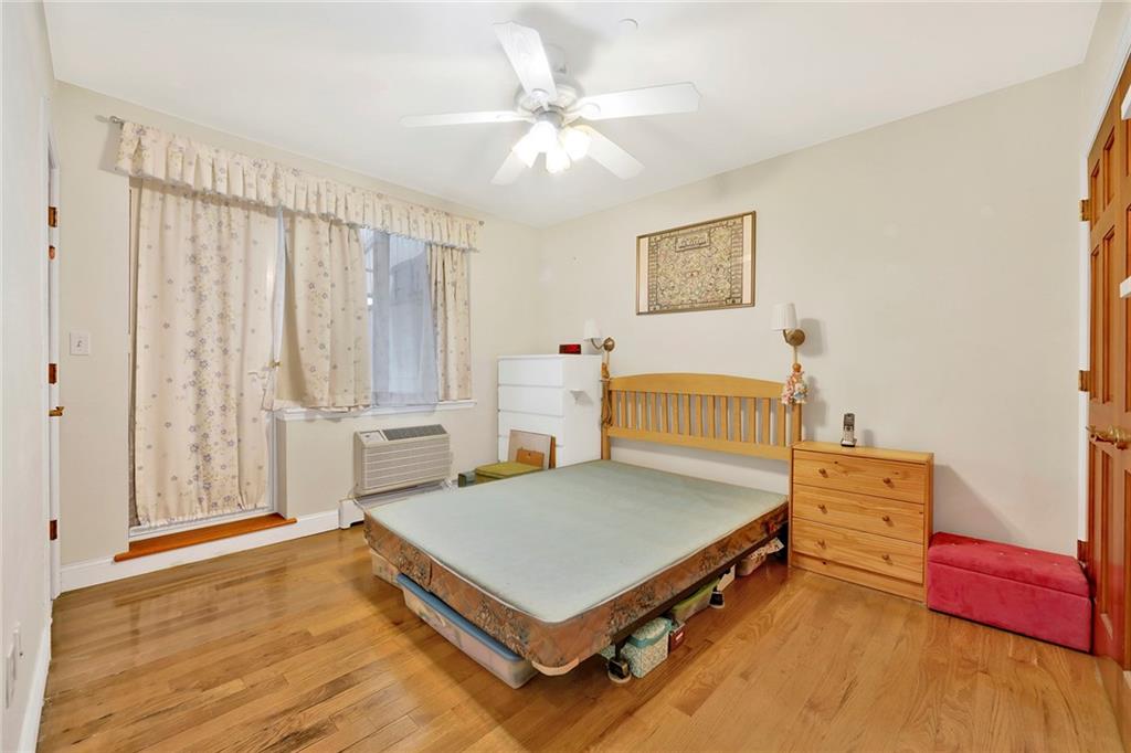 1270 Bay Ridge Parkway, Unit 6 Brooklyn, NY 11228 - Photo 21 of 24 a bedroom with a bed and a table in it