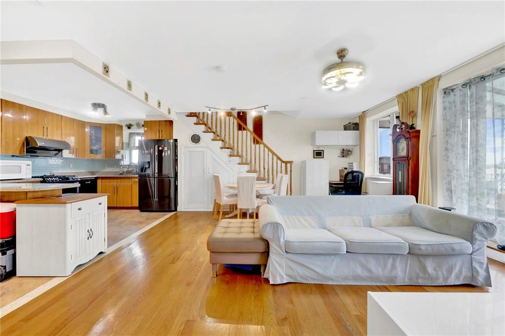 1270 Bay Ridge Parkway, Unit 6 Brooklyn, NY 11228 - Photo 5 of 24 a living room with furniture and a kitchen