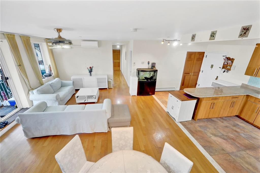 1270 Bay Ridge Parkway, Unit 6 Brooklyn, NY 11228 - Photo 7 of 24 a living room with furniture and wooden floor