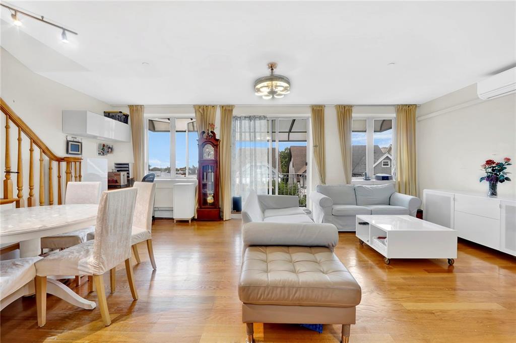 1270 Bay Ridge Parkway, Unit 6 Brooklyn, NY 11228 - Photo 8 of 24 a living room with furniture and a large window