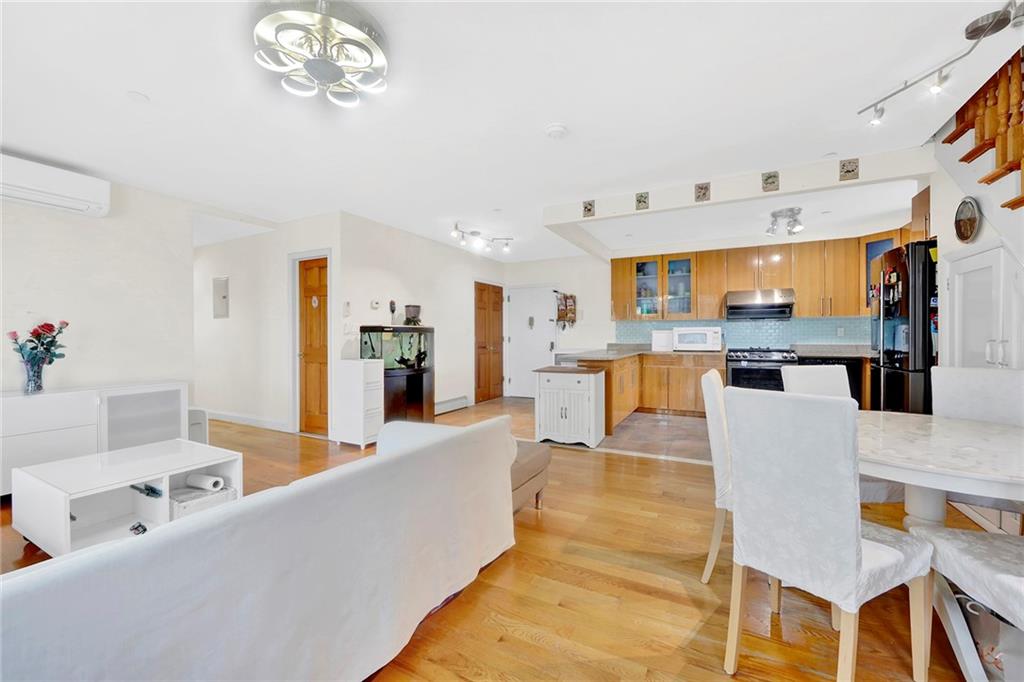 1270 Bay Ridge Parkway, Unit 6 Brooklyn, NY 11228 - Photo 9 of 24 a living room with furniture and kitchen view