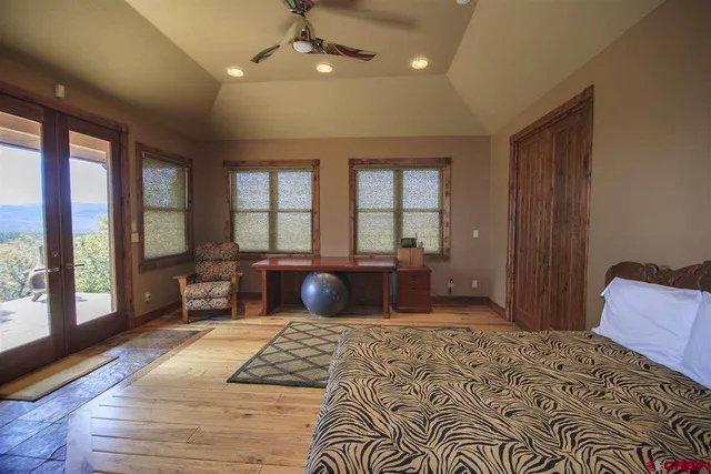 a bedroom with a large bed and a couch