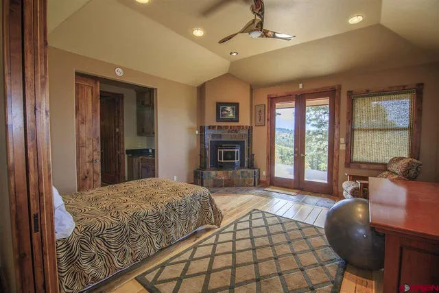 a spacious bedroom with a balcony a bed and a couch