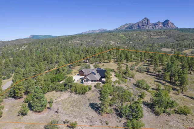 a view of a city with mountains in the background