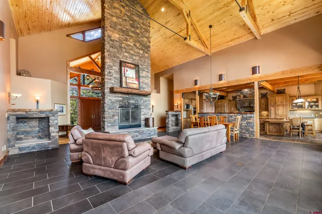 a view of a patio with couches and potted plants