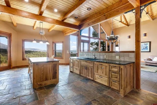 a open kitchen with stainless steel appliances granite countertop a sink and cabinets