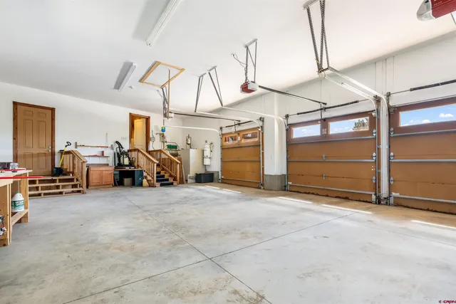 a view of a garage with cars