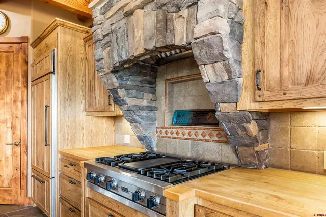 a kitchen with a stove and a cabinet