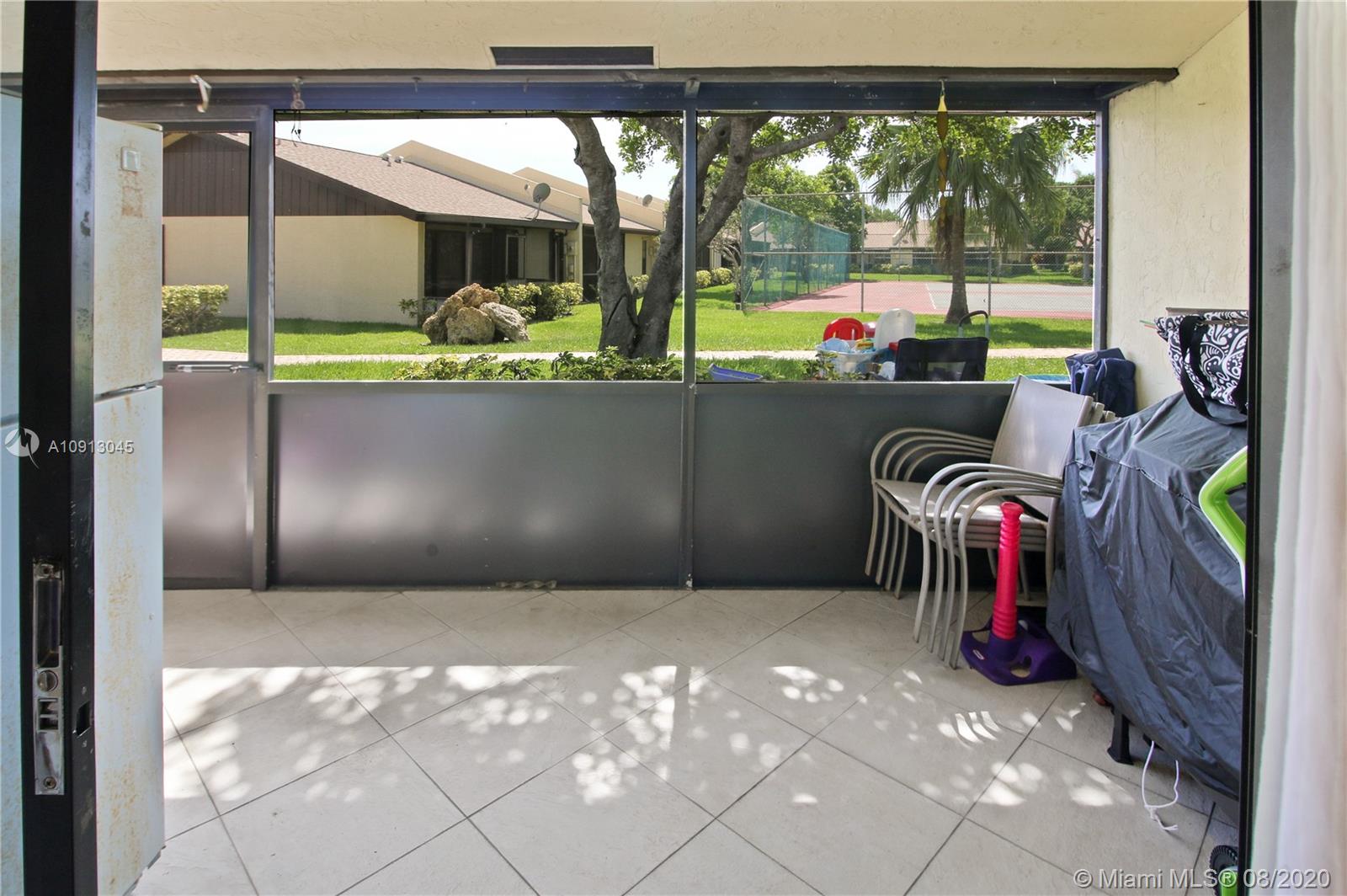 739 Banks Road Margate, FL 33063 - Photo 16 of 21 a view of a porch with furniture and garden