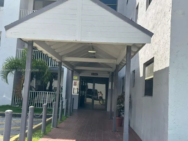 a kitchen with stainless steel appliances granite countertop a stove microwave and refrigerator