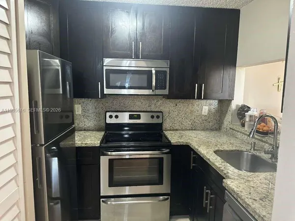 a view of a porch with wooden floor