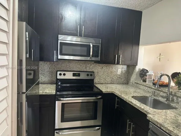 a view of a livingroom with wooden floor