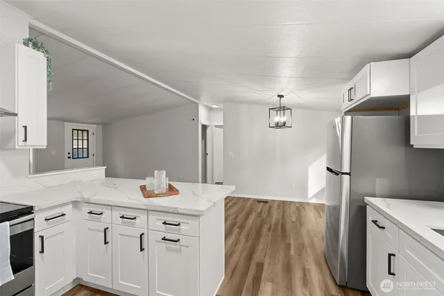 a bathroom with a sink vanity granite tub and shower