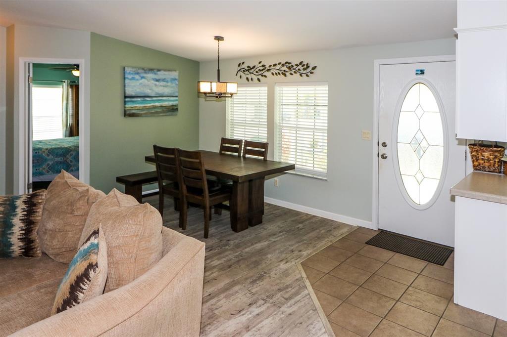 29200 South Jones Loop Road, Unit 522 Punta Gorda, FL 33950 - Photo 12 of 38 a living room with furniture and a large window