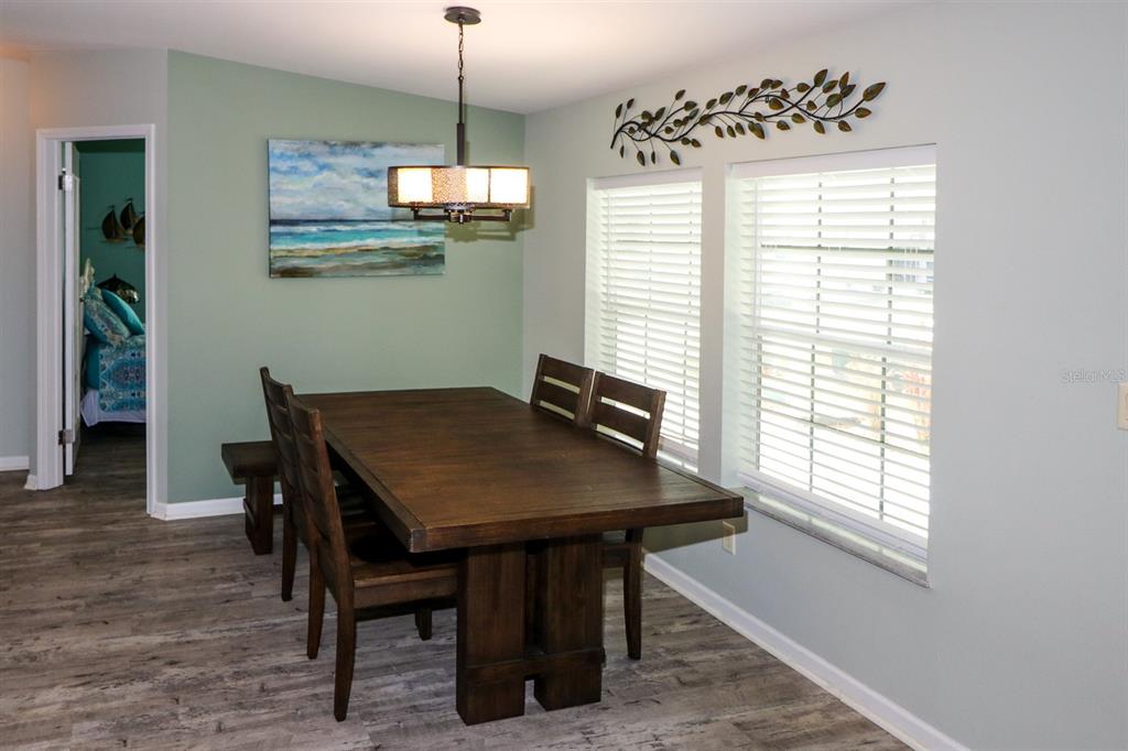 29200 South Jones Loop Road, Unit 522 Punta Gorda, FL 33950 - Photo 13 of 38 a view of a dining room with a table and chairs