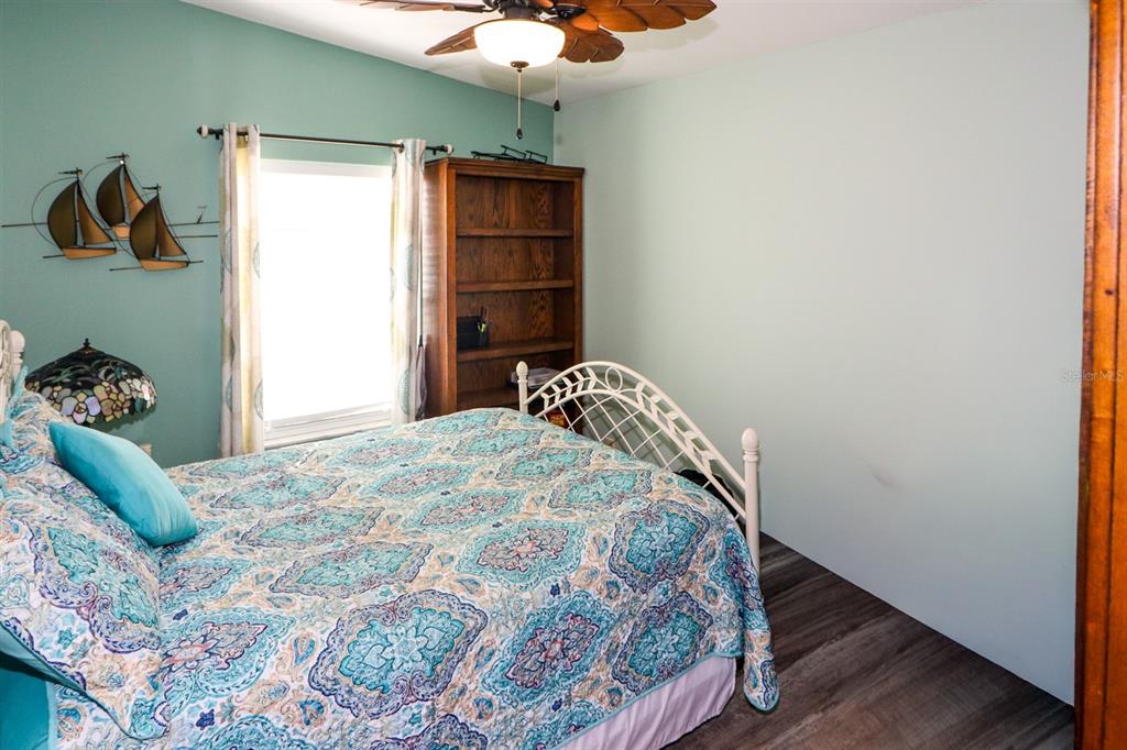 29200 South Jones Loop Road, Unit 522 Punta Gorda, FL 33950 - Photo 14 of 38 a bedroom with a bed and a window
