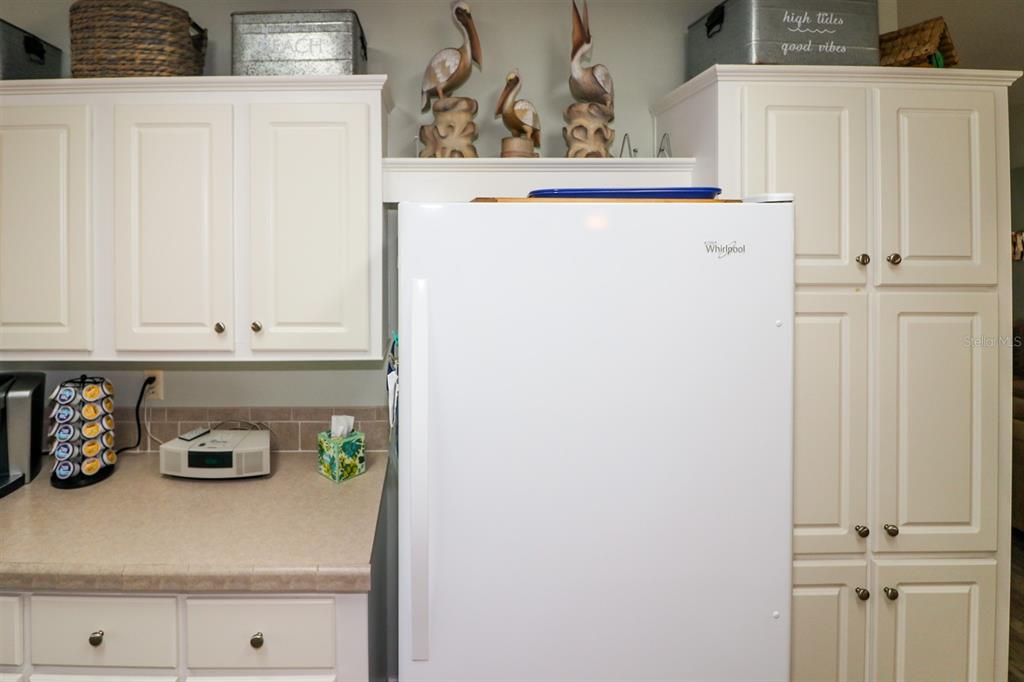 29200 South Jones Loop Road, Unit 522 Punta Gorda, FL 33950 - Photo 23 of 38 a close view of cabinet