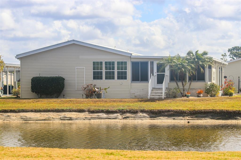 29200 South Jones Loop Road, Unit 522 Punta Gorda, FL 33950 - Photo 31 of 38 a view of swimming pool and lake view