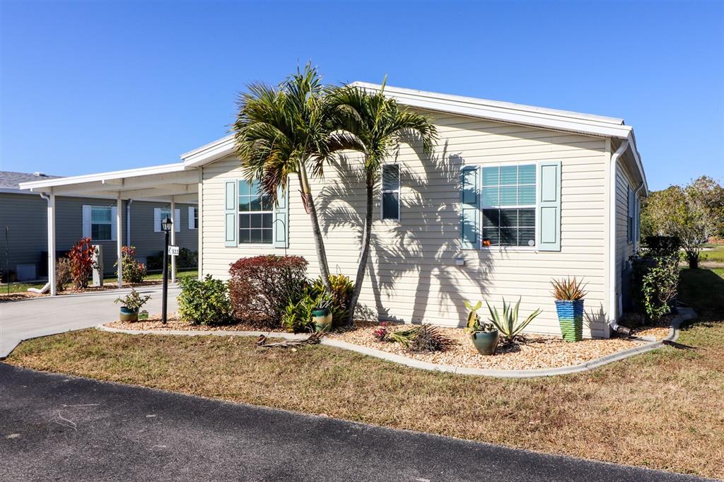29200 South Jones Loop Road, Unit 522 Punta Gorda, FL 33950 - Photo 34 of 38 a view of a house with a patio