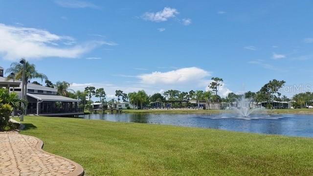 29200 South Jones Loop Road, Unit 522 Punta Gorda, FL 33950 - Photo 36 of 38 a view of a lake with houses