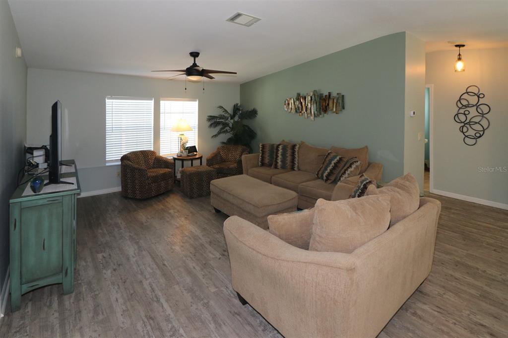 29200 South Jones Loop Road, Unit 522 Punta Gorda, FL 33950 - Photo 4 of 38 a living room with furniture and a large window