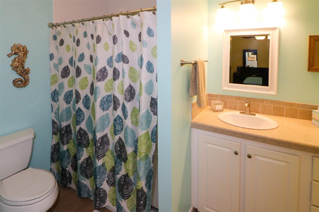 29200 South Jones Loop Road, Unit 522 Punta Gorda, FL 33950 - Photo 9 of 38 a bathroom with a sink toilet and shower
