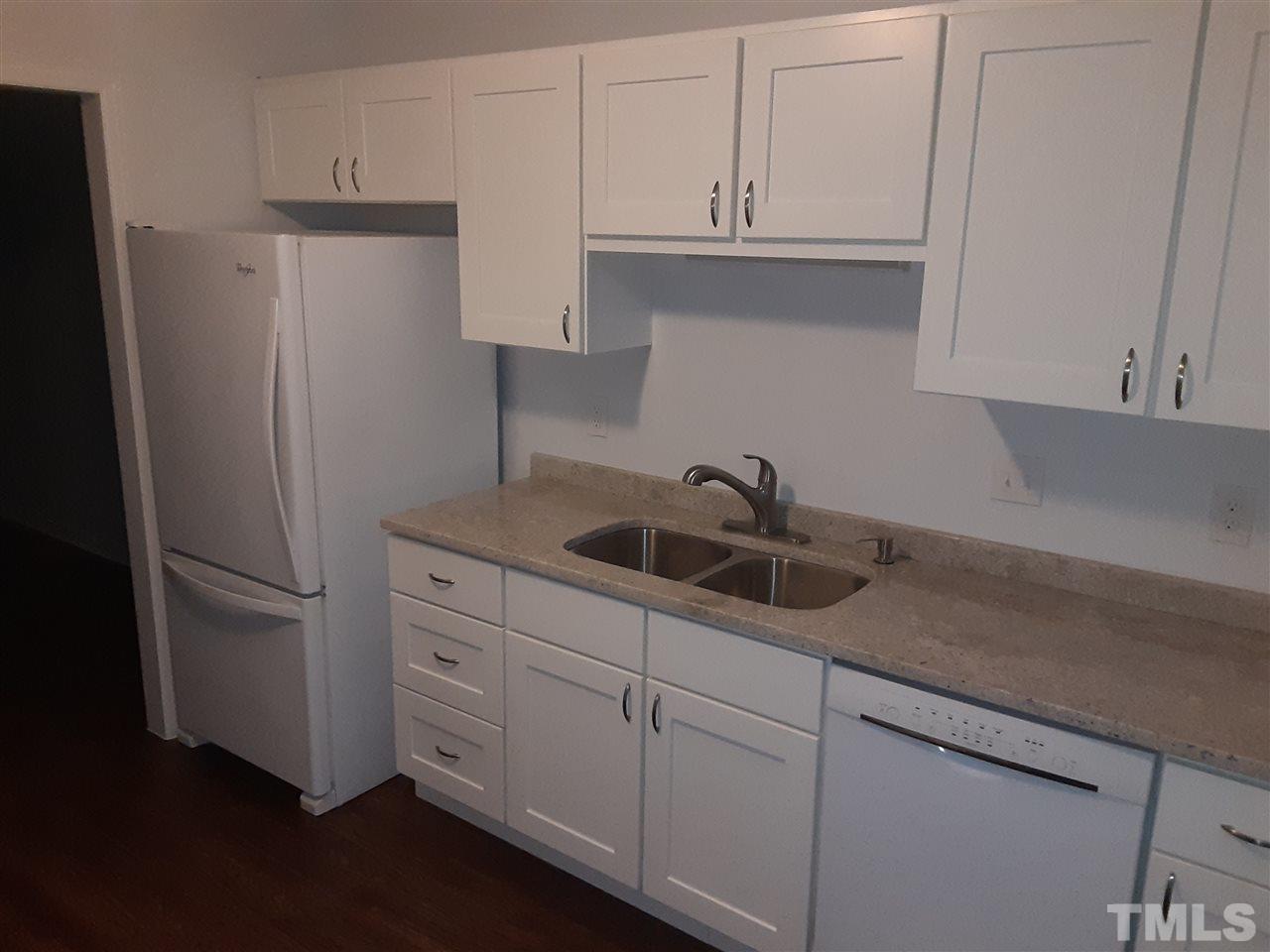6788 Chauncey Drive Raleigh, NC 27615 - Photo 5 of 30 New Cabinets, solid countertops. Fresh flooring and paint!