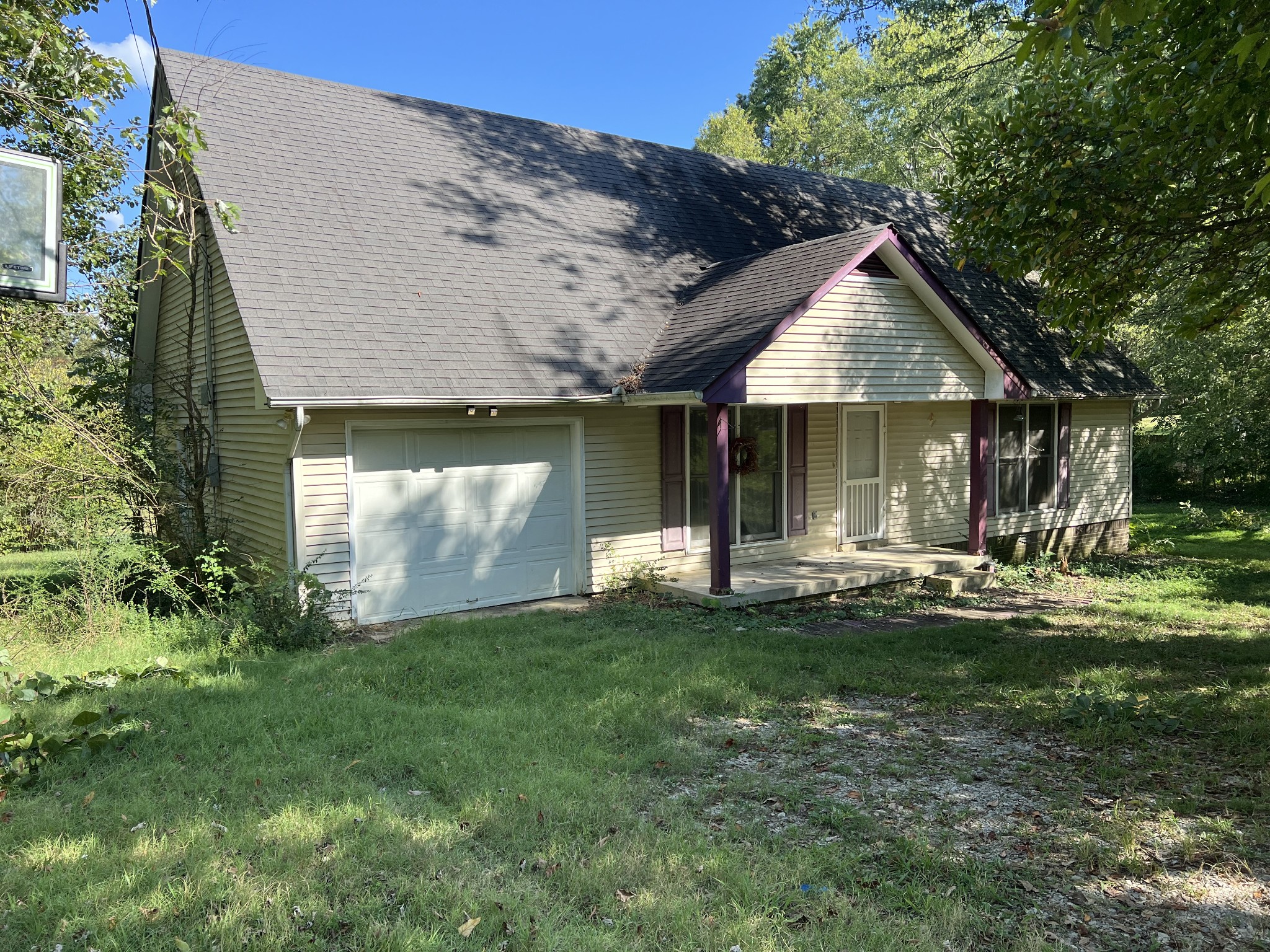 1161 Windsor Circle Lyles, TN 37098 - Photo 3 of 3 a front view of a house with a garden and yard