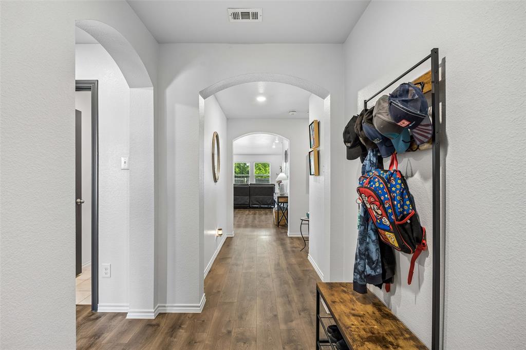 802 Rustic Way Royse City, TX 75189 - Photo 11 of 38 a view of a hallway with wooden floor and closet