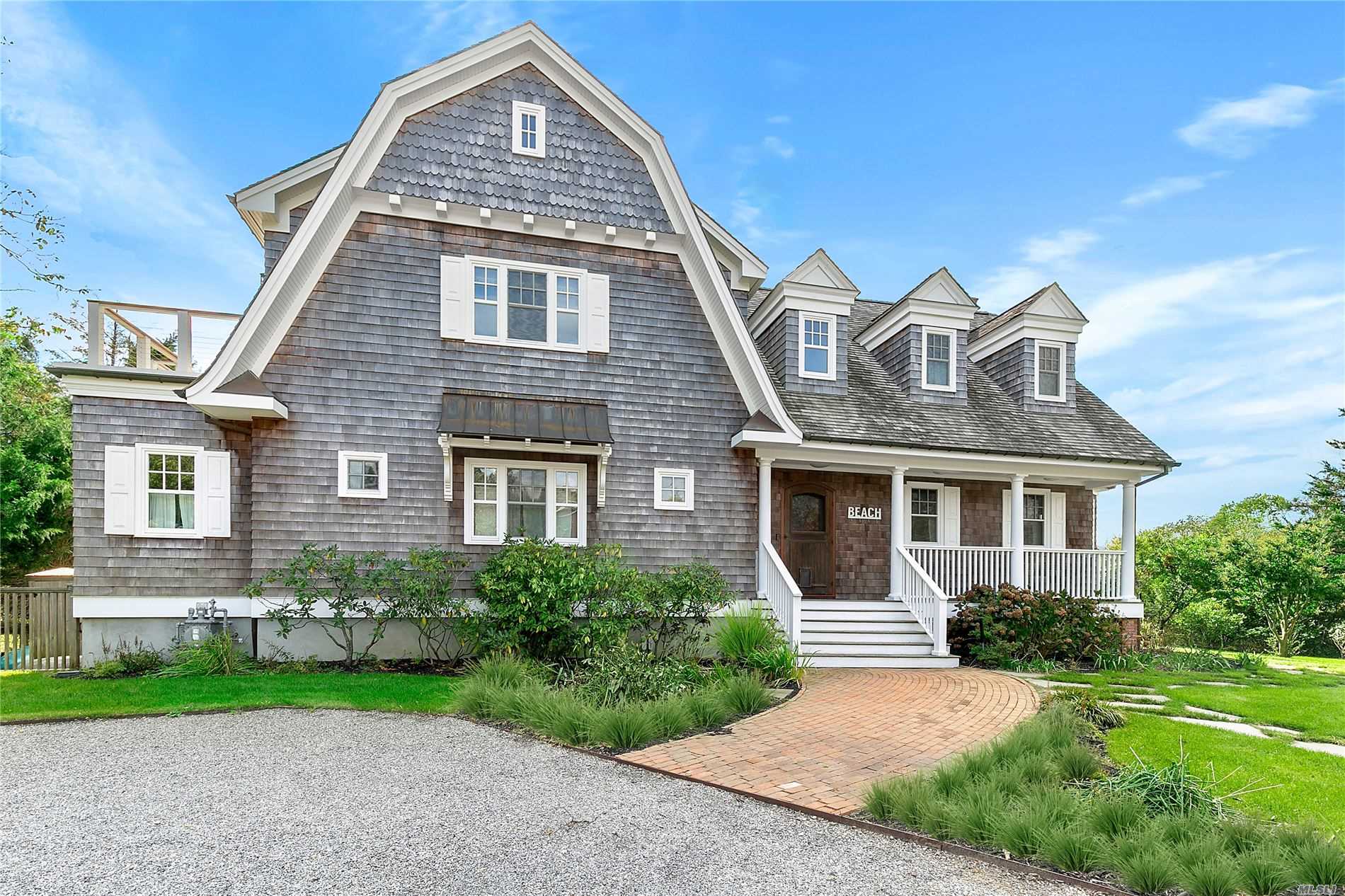 11 Long Point Road Sag Harbor, NY 11963 - Photo 1 of 1 a front view of a house with garden