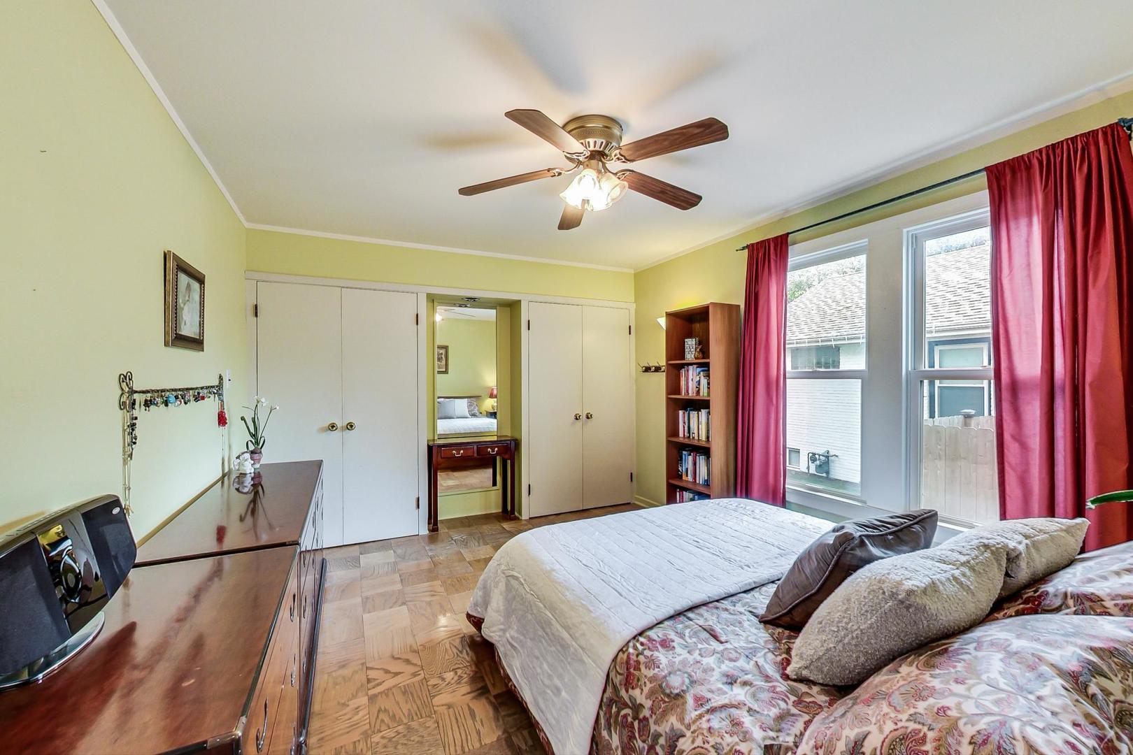 431 Selborne Road Riverside, IL 60546 - Photo 12 of 33 a bedroom with a bed and a chandelier