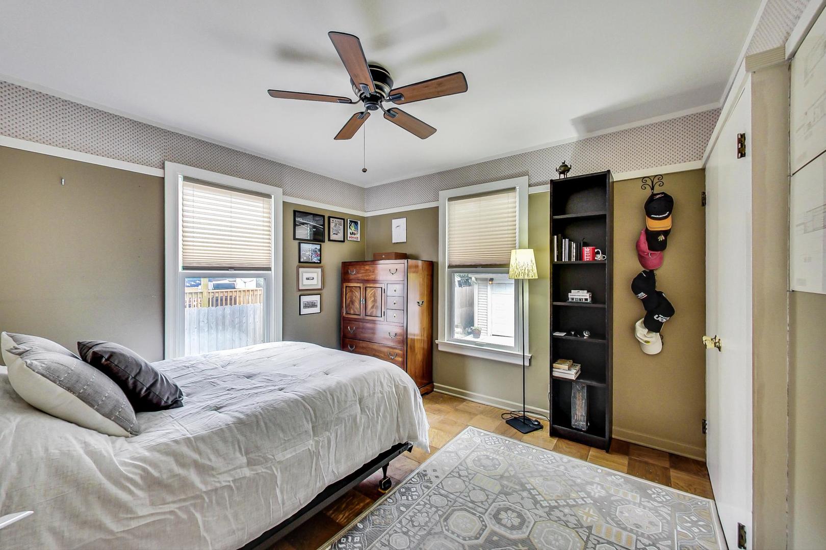 431 Selborne Road Riverside, IL 60546 - Photo 13 of 33 a bedroom with a bed cabinets and window