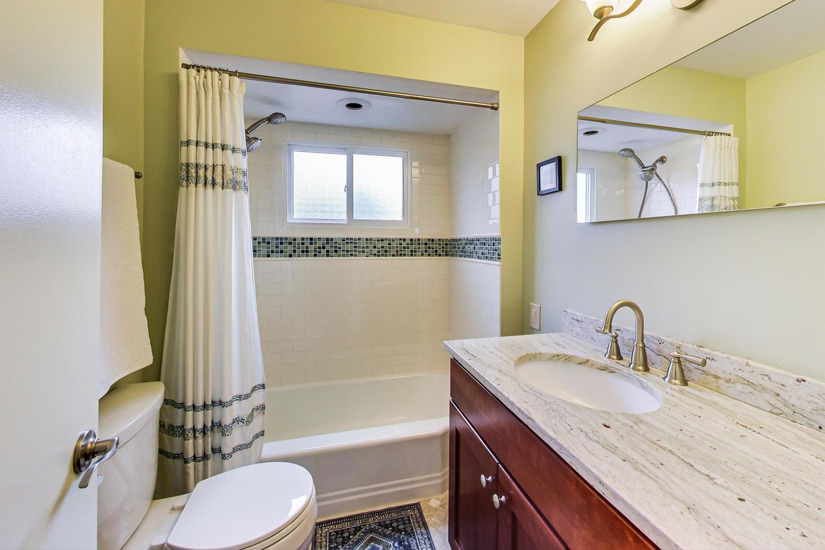 431 Selborne Road Riverside, IL 60546 - Photo 15 of 33 a bathroom with a granite countertop sink toilet and shower