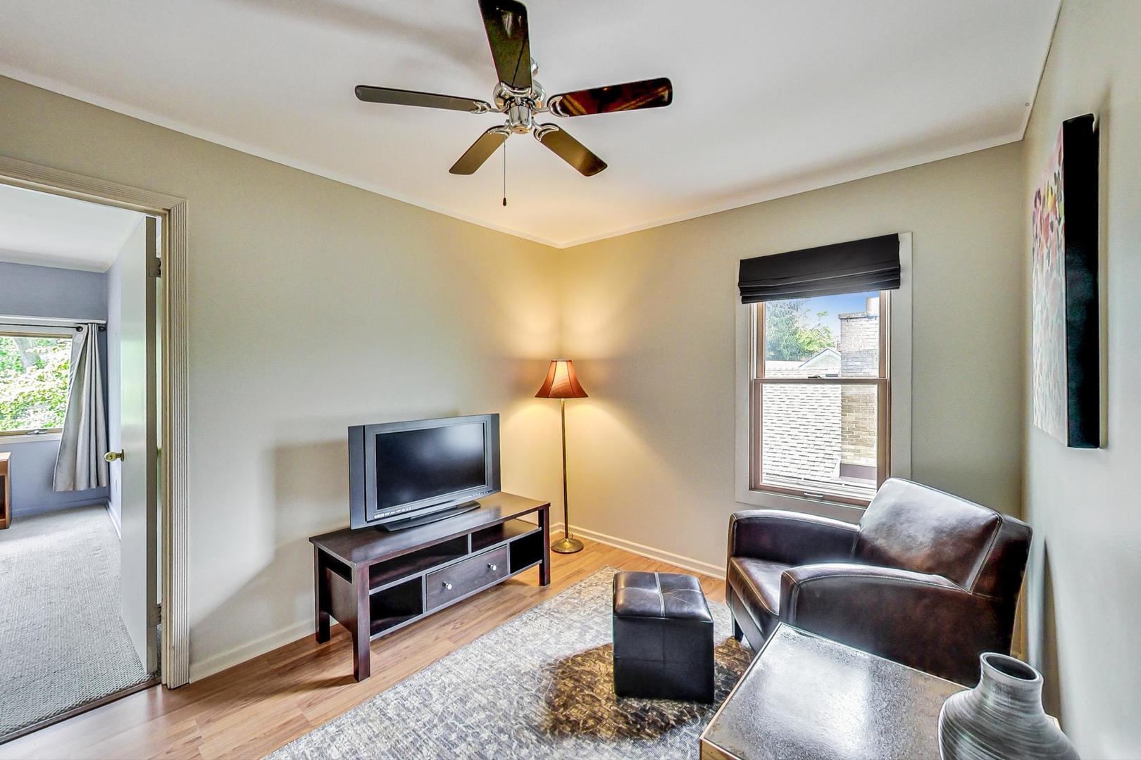 431 Selborne Road Riverside, IL 60546 - Photo 16 of 33 a living room with furniture and a flat screen tv