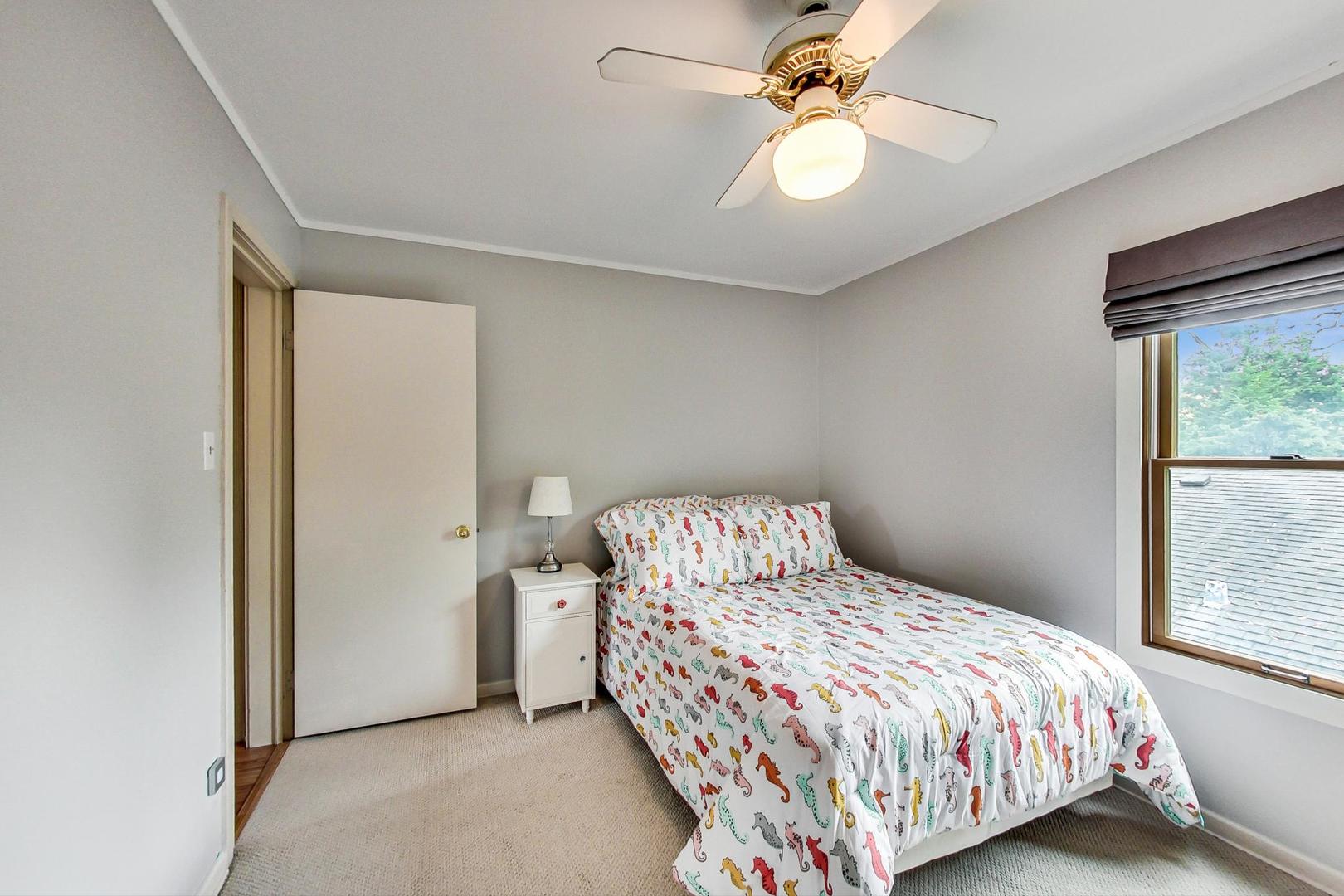 431 Selborne Road Riverside, IL 60546 - Photo 19 of 33 a bedroom with a bed and a window