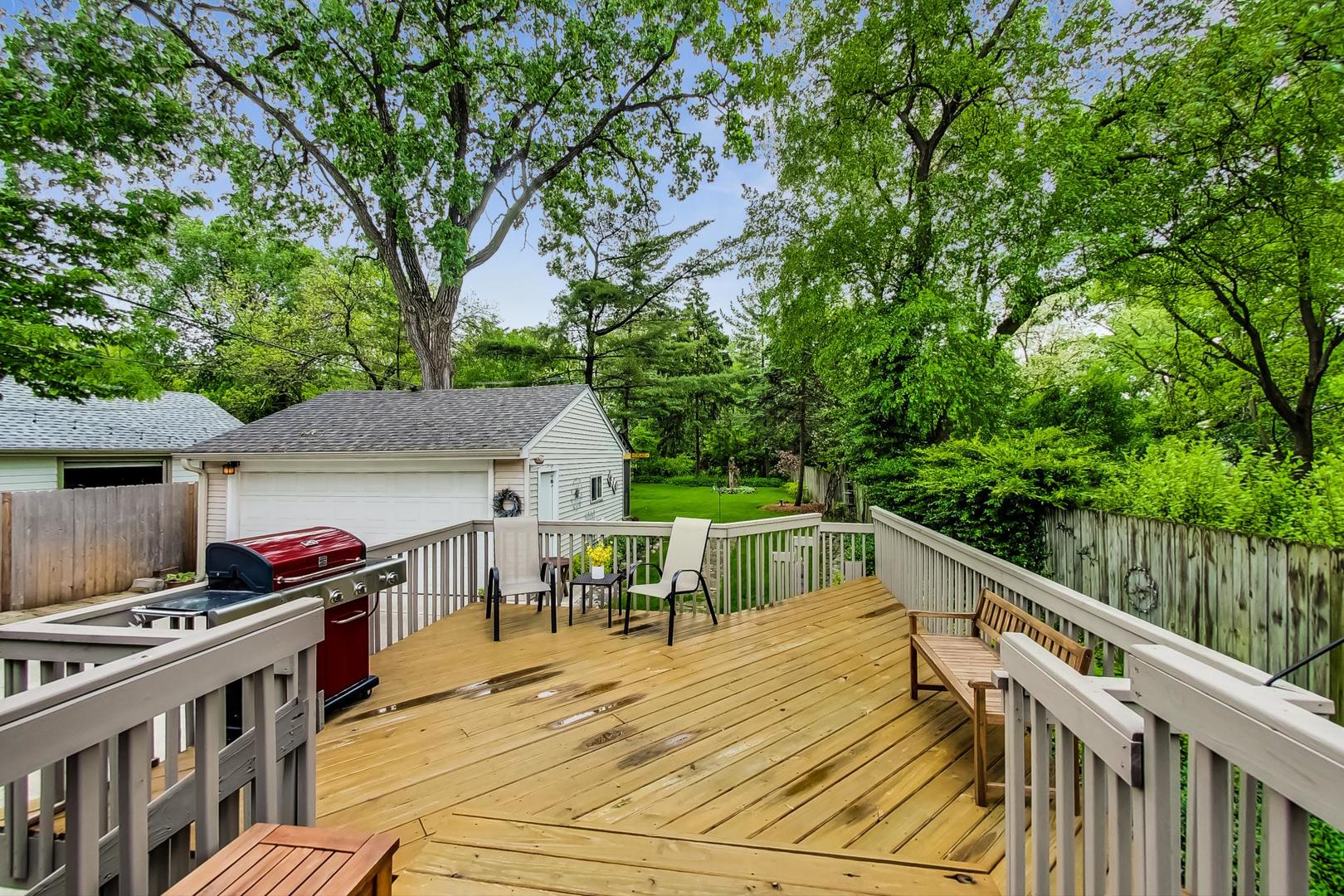 431 Selborne Road Riverside, IL 60546 - Photo 25 of 33 a view of a patio with table and chairs and wooden floor