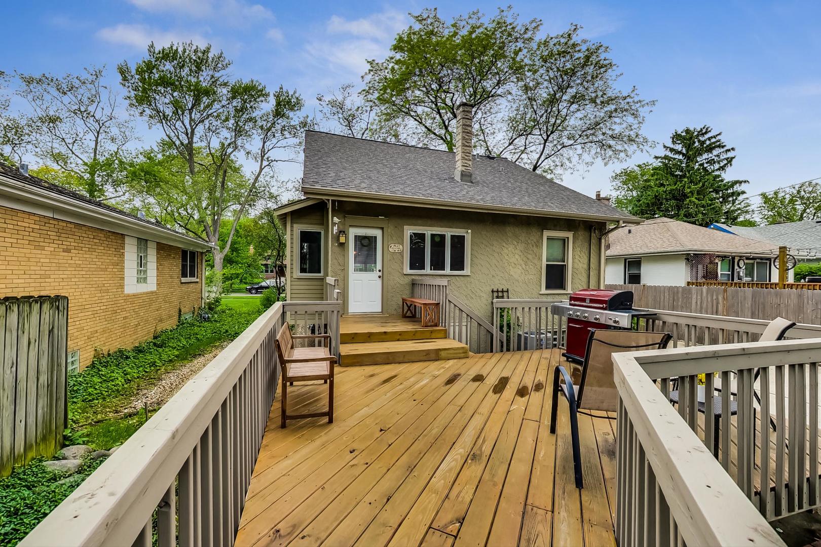 431 Selborne Road Riverside, IL 60546 - Photo 26 of 33 a view of a house with wooden deck and furniture
