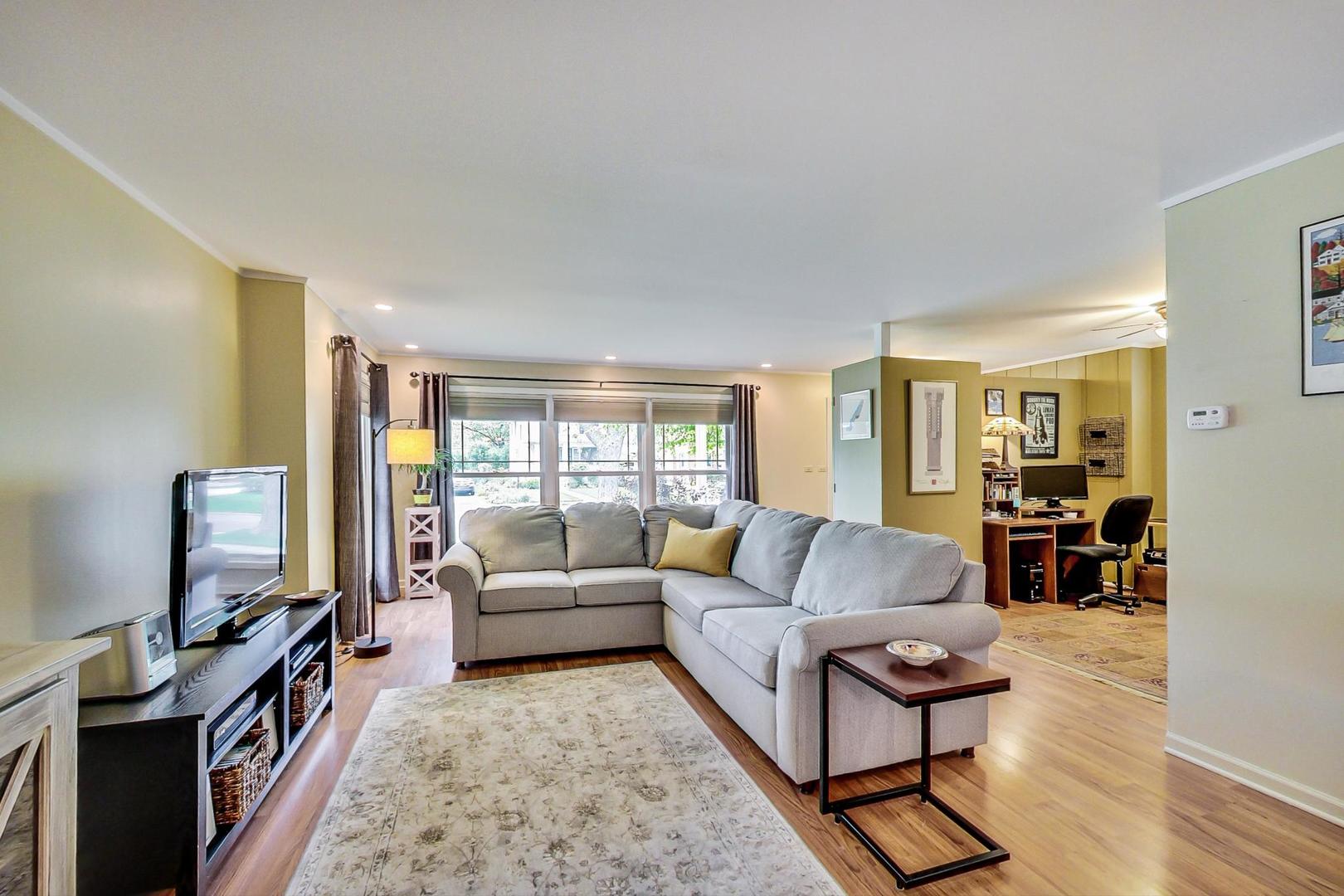 431 Selborne Road Riverside, IL 60546 - Photo 3 of 33 a living room with furniture a flat screen tv and a window