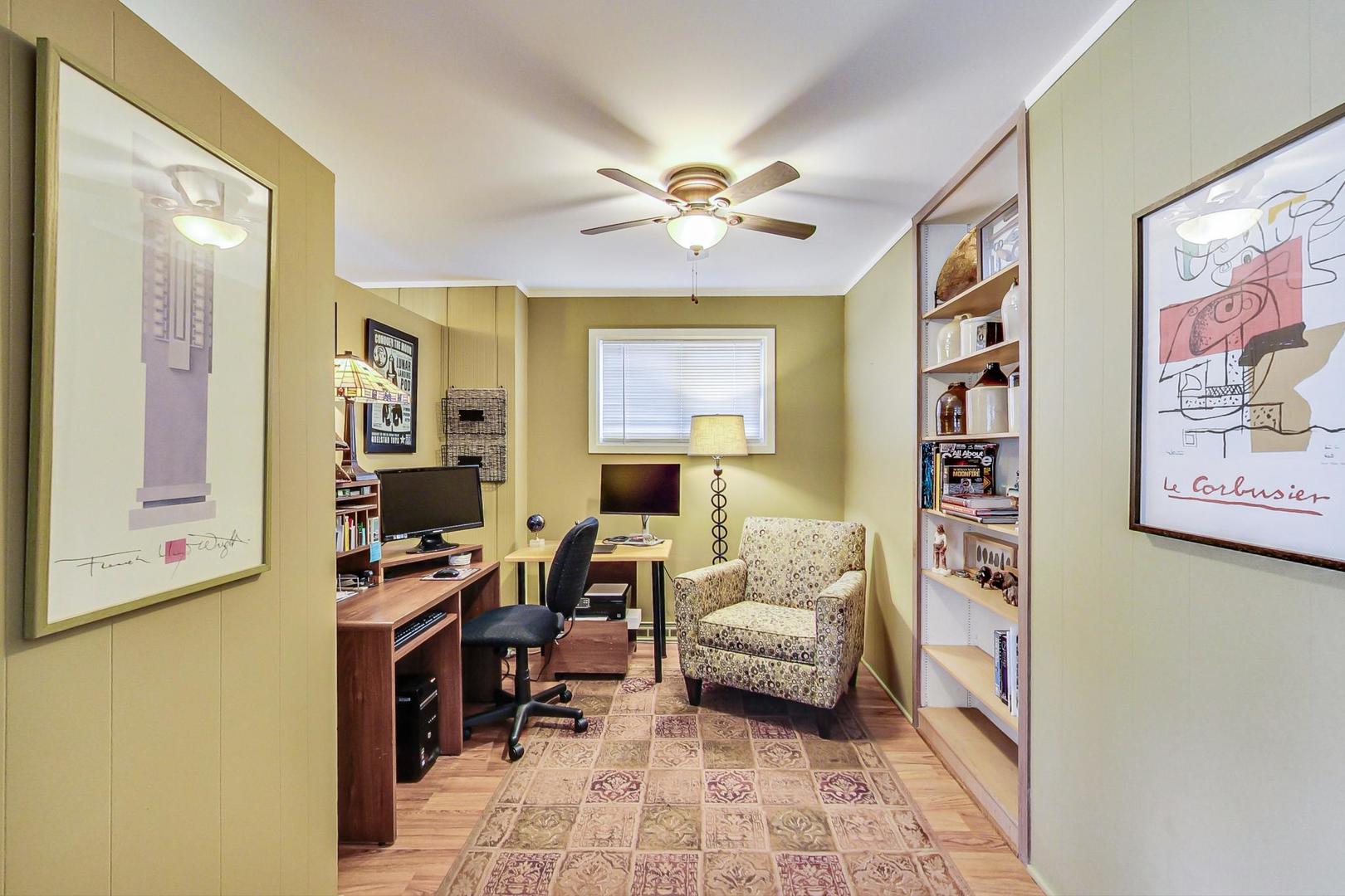 431 Selborne Road Riverside, IL 60546 - Photo 5 of 33 a bedroom with a bed and a chandelier