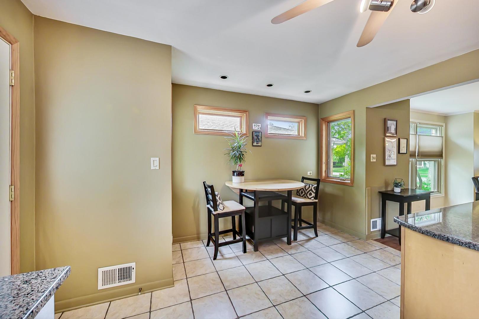 431 Selborne Road Riverside, IL 60546 - Photo 10 of 33 a view of a dining room with furniture and a window