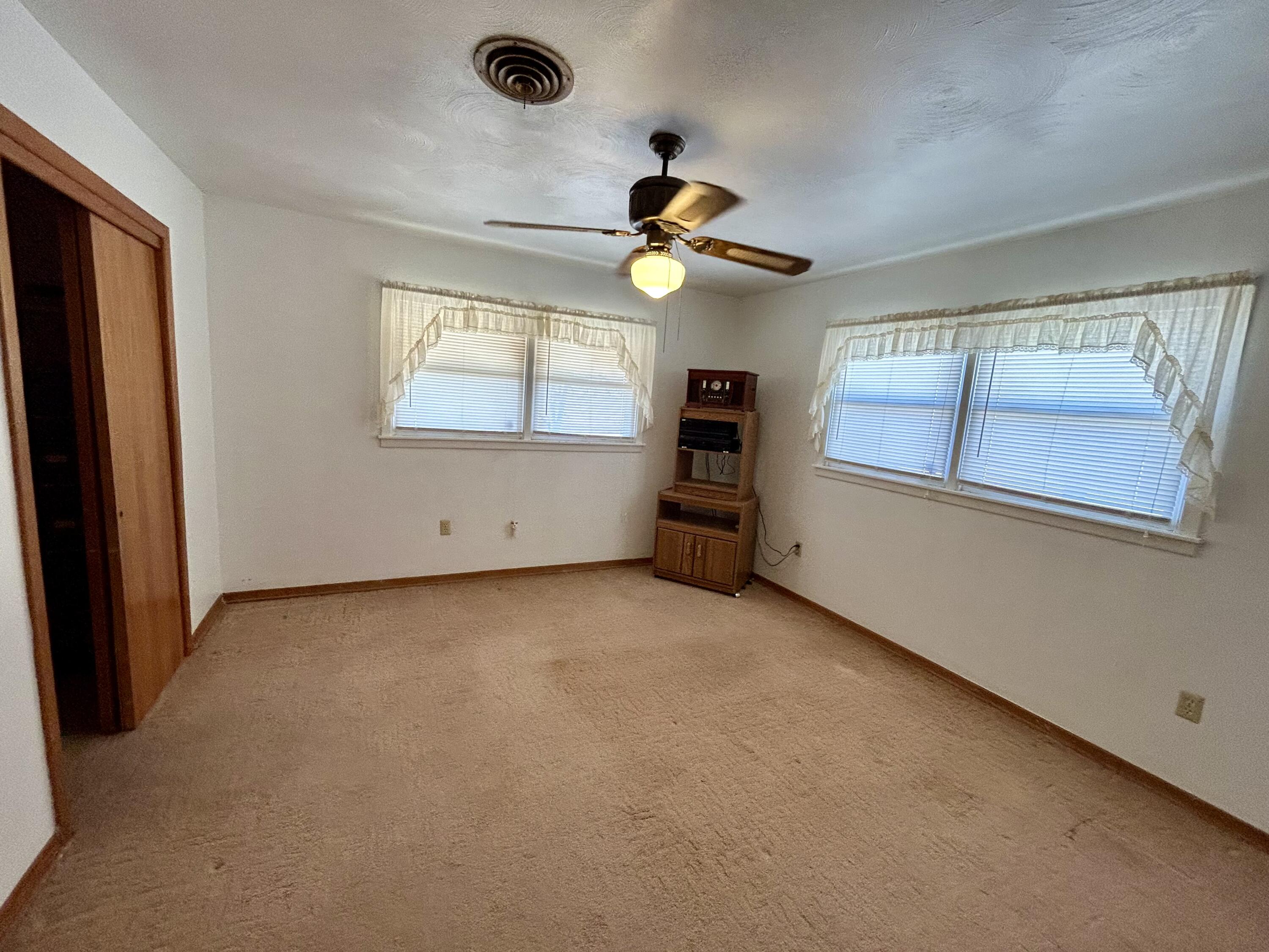 2101 Farm To Market 97 Lockney, TX 79241 - Photo 12 of 35 an empty room with windows and fan