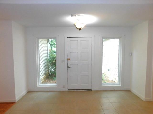 1710 Pine Road Marietta, GA 30062 - Photo 3 of 23 an empty room with windows and entrance