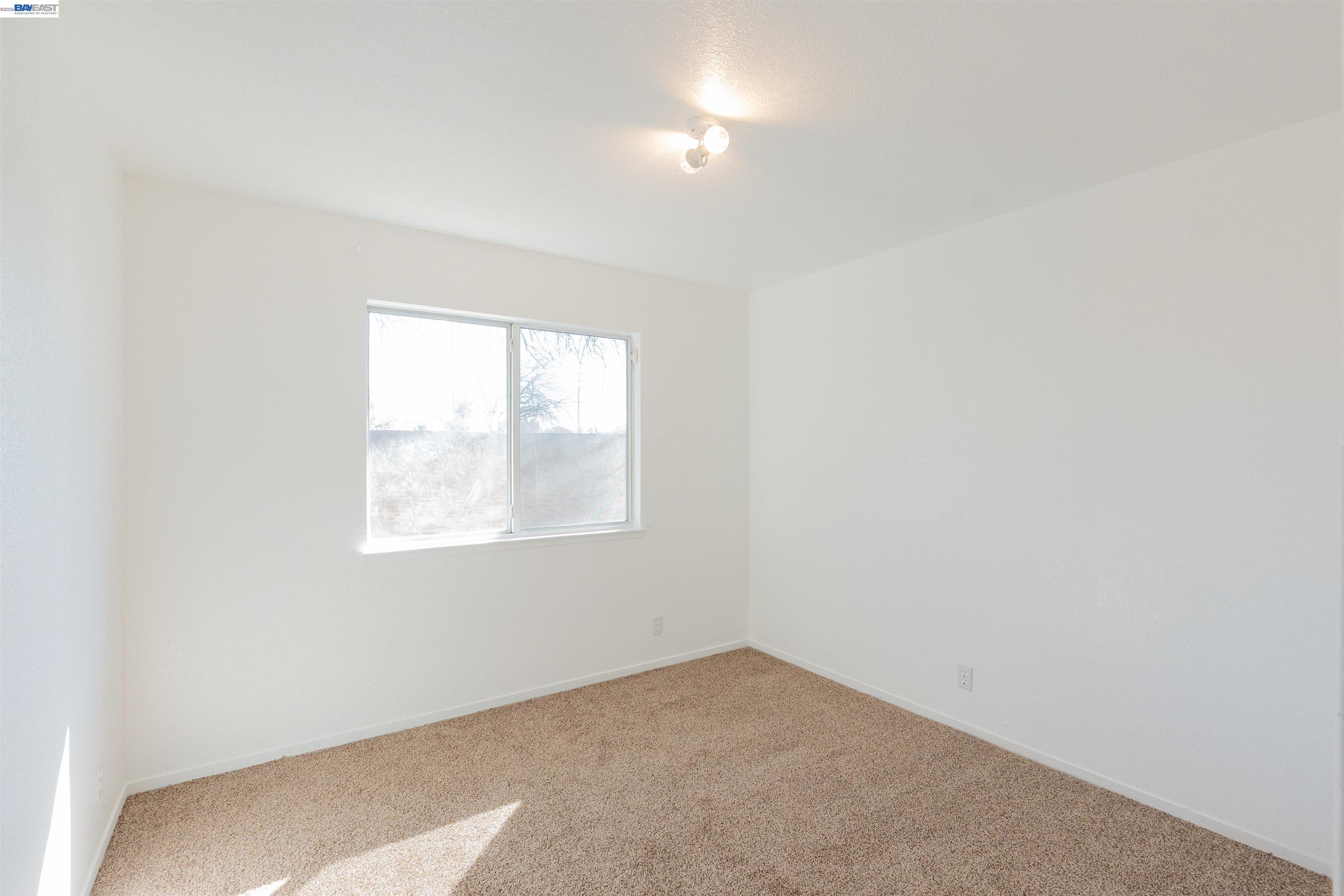 2932 Alcott Court Modesto, CA 95355 - Photo 18 of 39 an empty room with a window