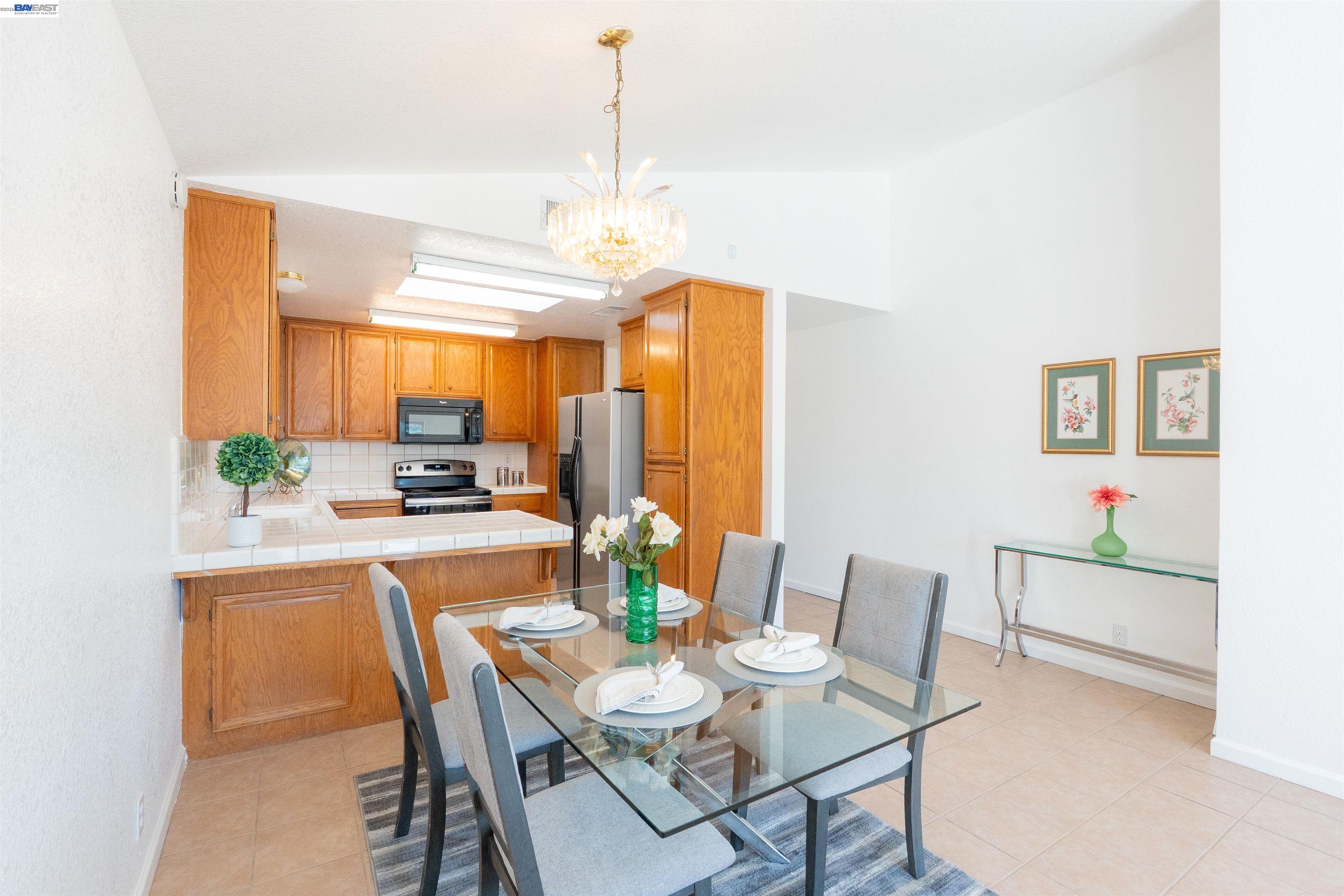 2932 Alcott Court Modesto, CA 95355 - Photo 32 of 39 a view of a dining room with furniture window and wooden floor