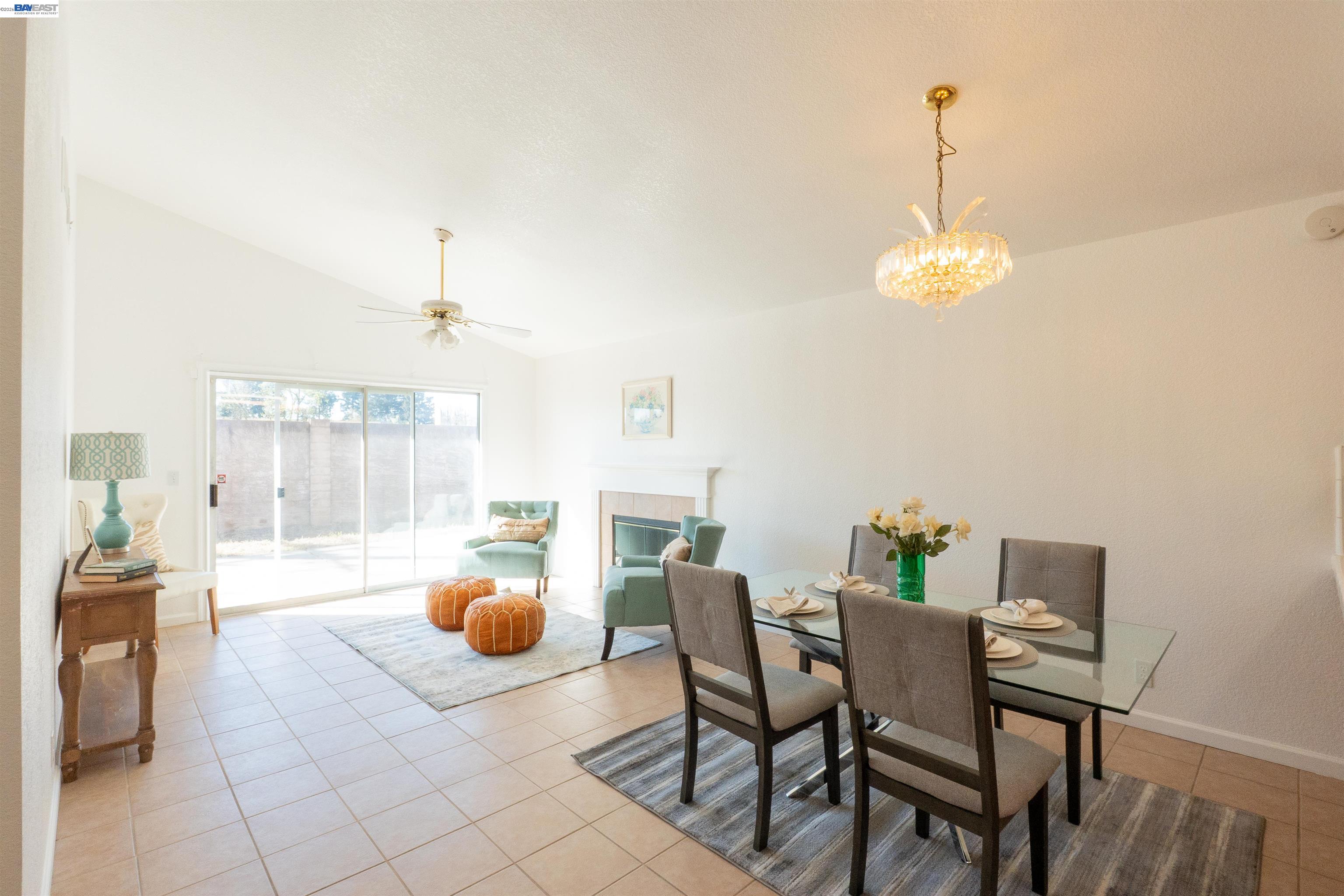 2932 Alcott Court Modesto, CA 95355 - Photo 37 of 39 a view of dining room and kitchen with furniture and chandelier